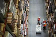 Workers in a warehouse following safety procedures.