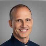 Headshot of Chad Stevenson, smiling professionally.